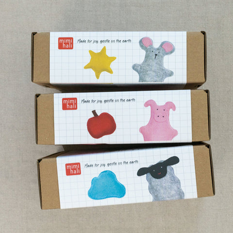 Three farmstead boxes with illustrations and text on a neutral background