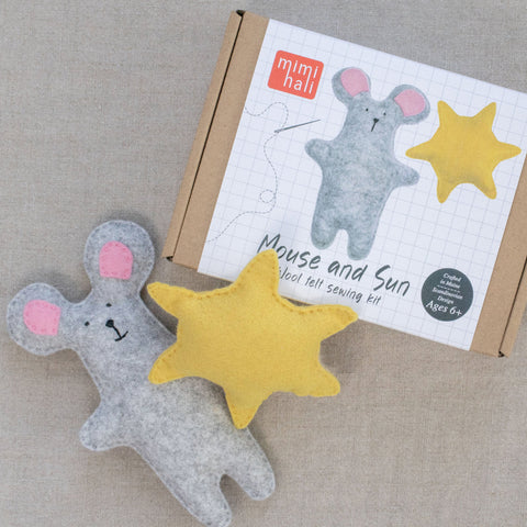 Felt mouse and sun toys with mimihali packaging on a neutral background