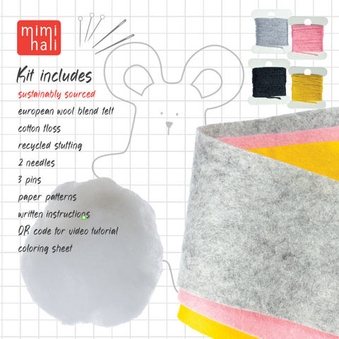 Felt craft kit with materials and tools on a grid background