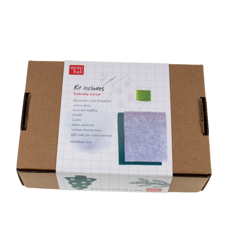 Cardboard box packaging for tree ornament on a white background