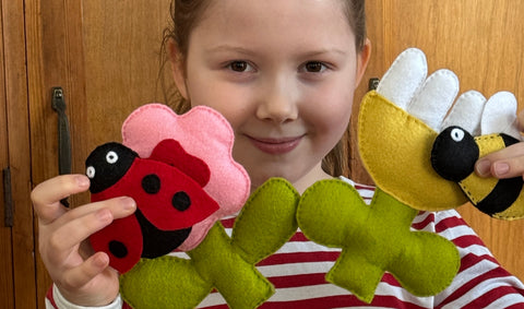 girl with hans sewn flowers
