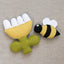 Felt bee and flower toy on a textured neutral background